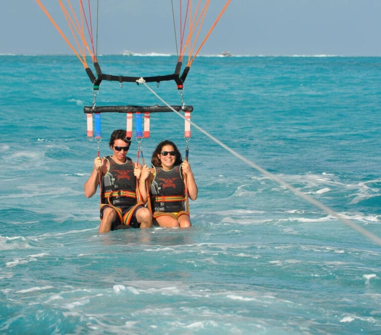 Guests soaring above the turquoise waters of Grace Bay